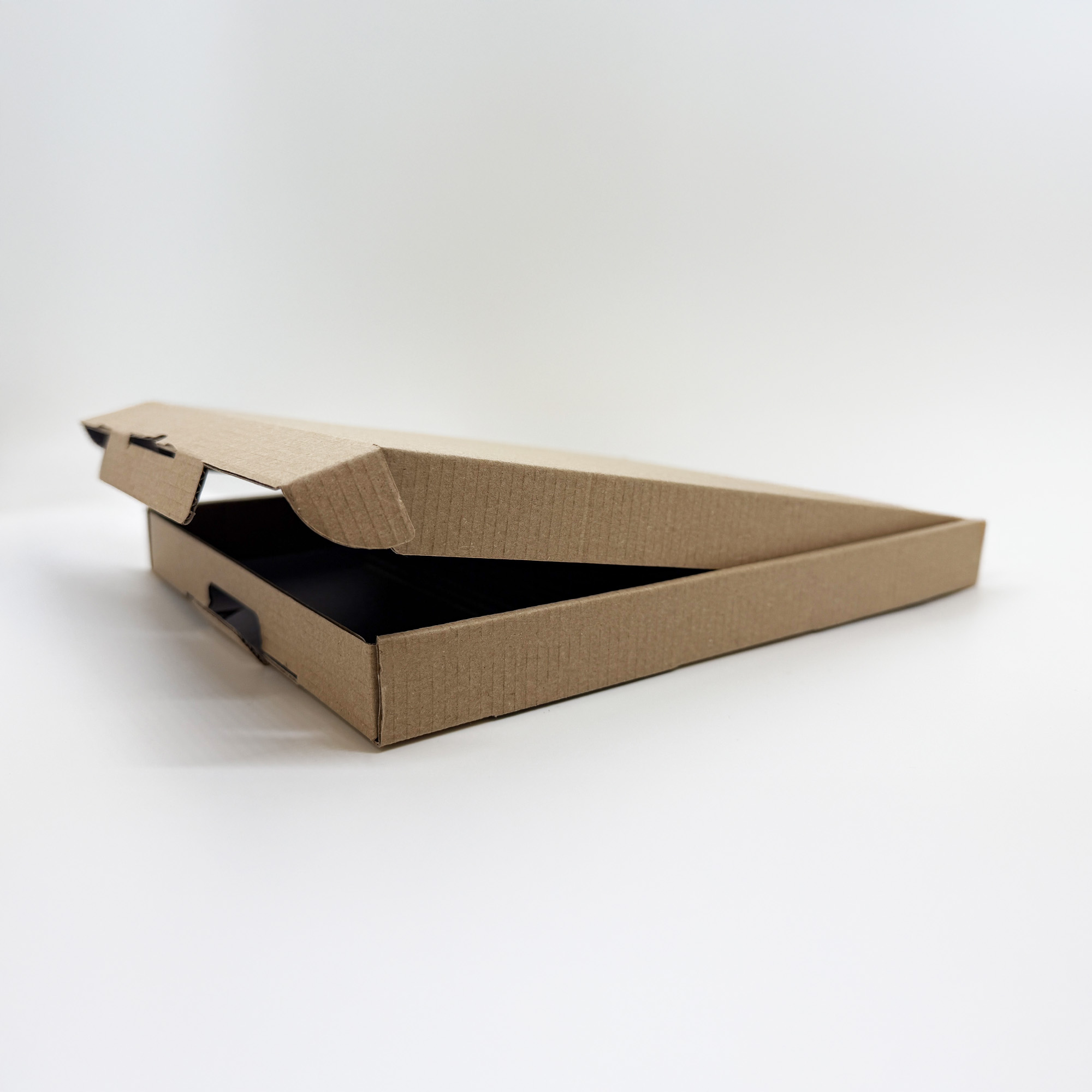A custom-sized corrugated postal box for e-commerce, available in small runs and ready to be branded by the in-house design team at Indigo Ross.