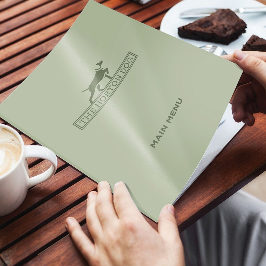 Clean, professional restaurant menu design for The Norton Dog in Suffolk, printed on premium card stock.