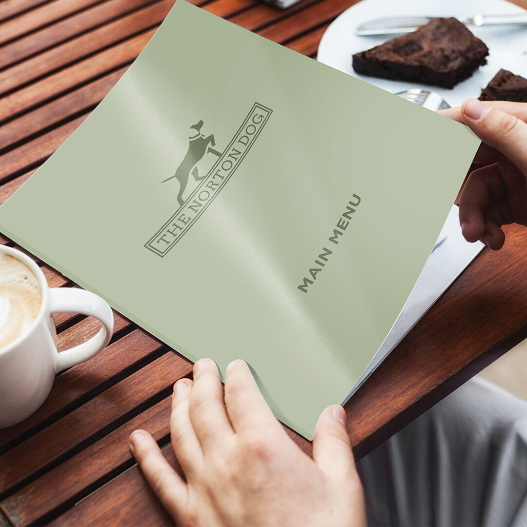 Clean, professional restaurant menu design for The Norton Dog in Suffolk, printed on premium card stock.
