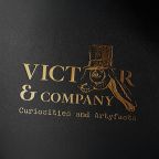 Premium gold foil mockup of the Victor & Company logo on a textured black background,